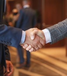 Men shake hands at business meeting